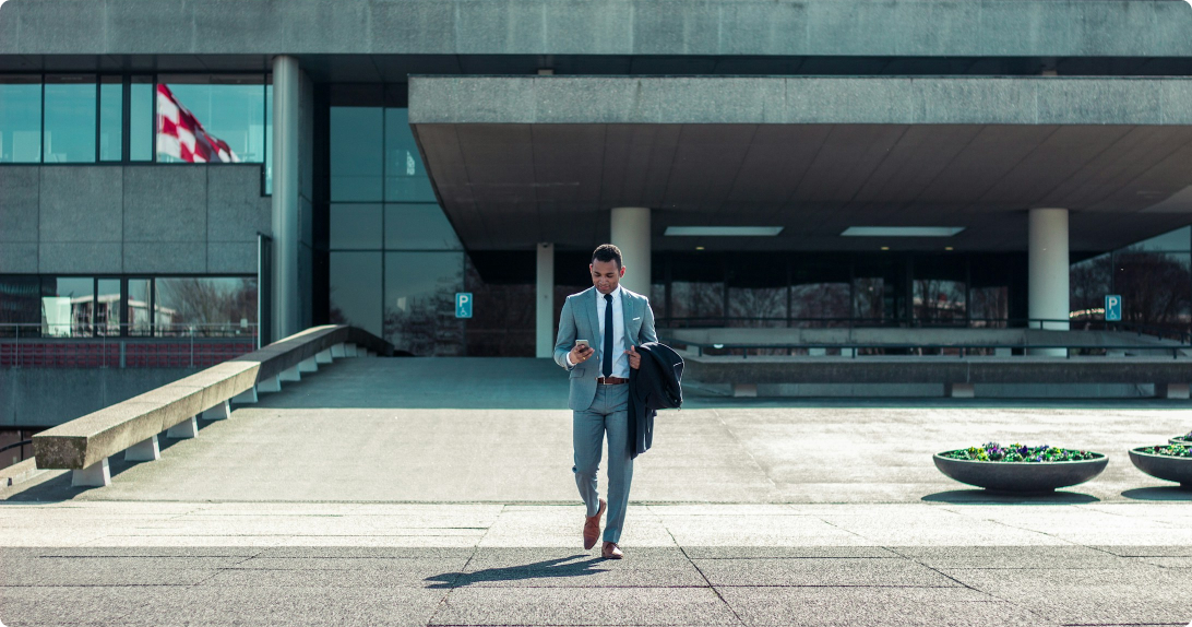 Business professional outside a modern office building